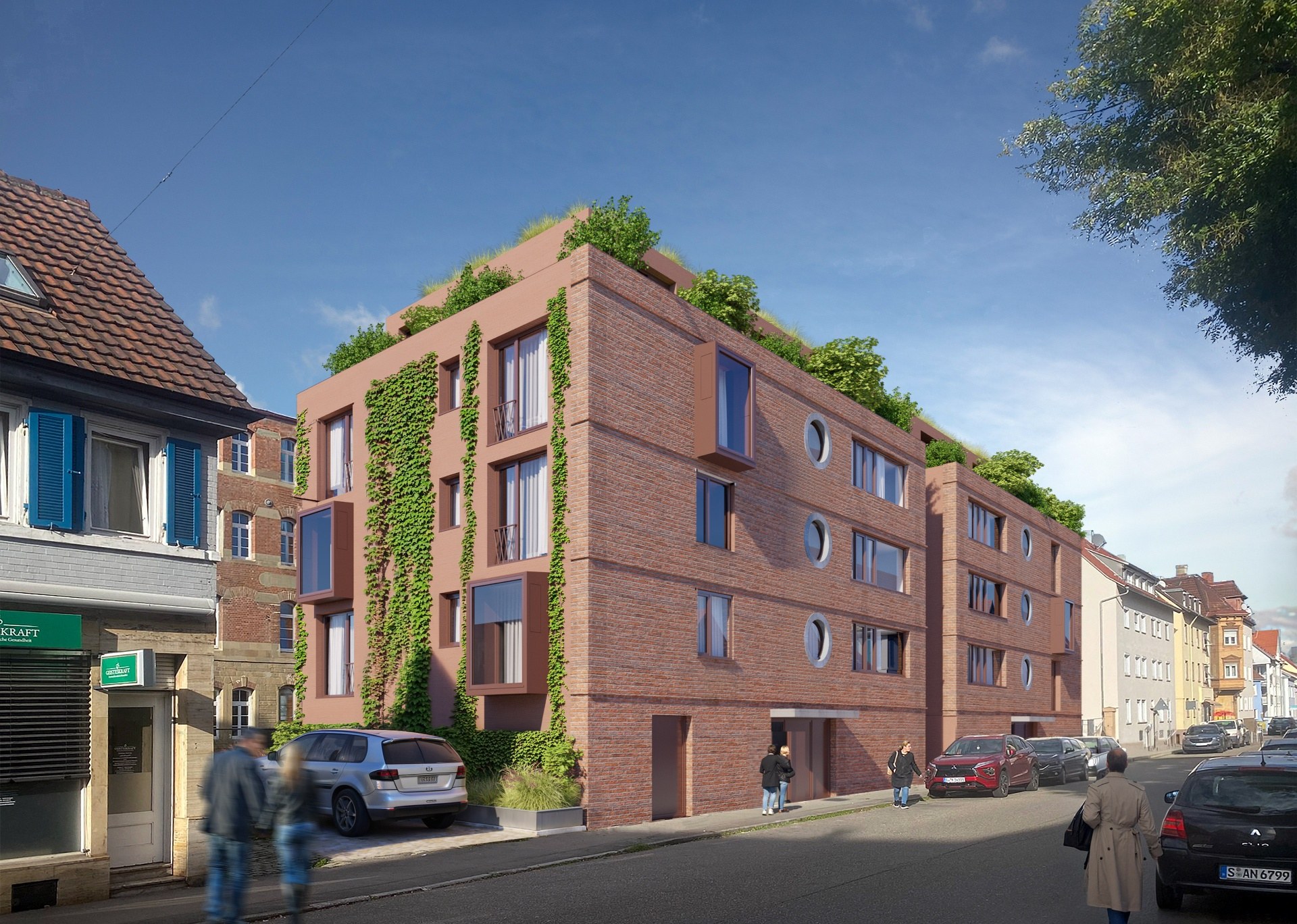 Straßenansicht des Neubauprojekts in Stuttgart-Bad Cannstatt mit verklinkerter Terrakotta-Fassade und begrünter Dachterrasse
