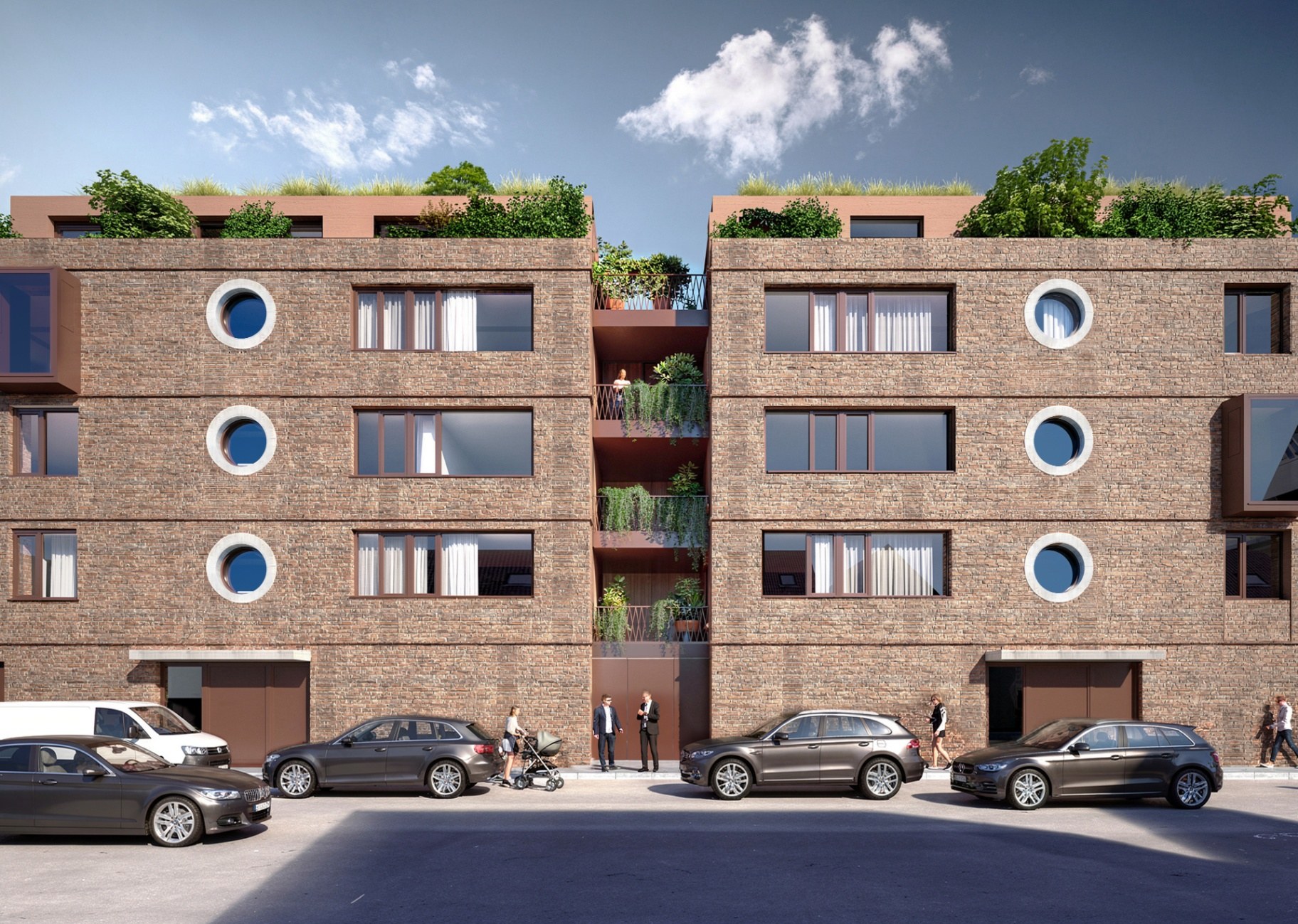 Detailansicht der Klinkerfassade mit charakteristischen runden Bullaugen-Fenstern und begrünten Dachterrassen